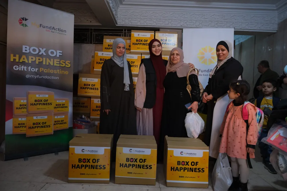 Women collecting MyFundAction 'Box of Happiness' food boxes for Palestine